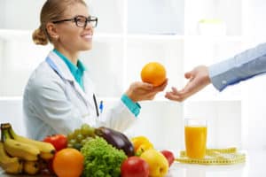 Nutritionist With Female Patient