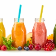 A row of healthy fresh fruit smoothies for hair nutritional needs