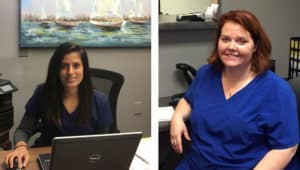 Reena Bhakta and Adrienne Taylor, two new hires in blue scrubs, sitting in front of a computer while discussing HPI.