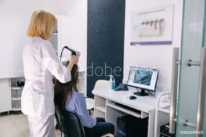 Woman Receiving Hair Scan Preview