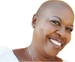 A smiling woman with alopecia.
