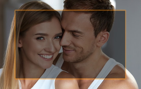 Smiling woman with fresh soft face skin and a handsome man together
