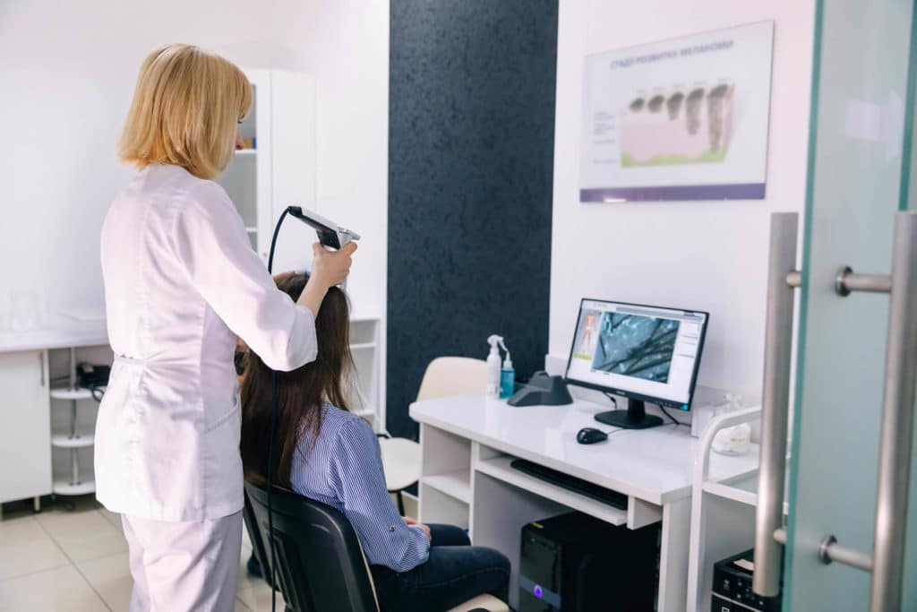 Woman Receiving Hair Scan