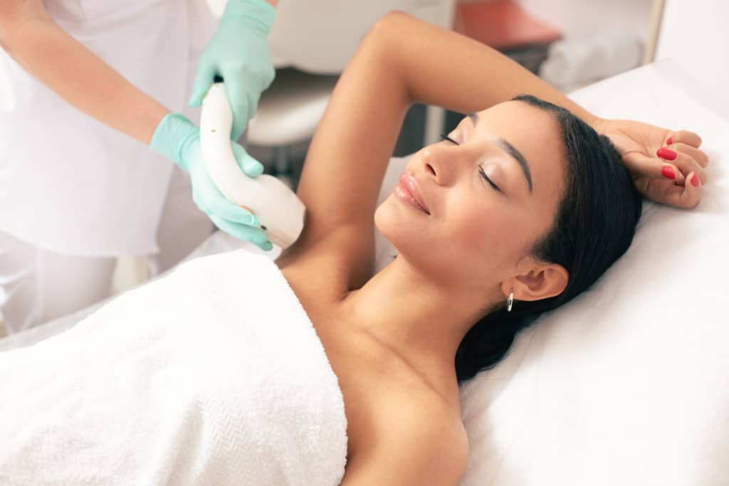 Woman Receiving Laser Hair Removal Scaled
