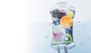 A bag filled with fruit floating in the water, providing a refreshing and enriching experience for hair iv therapy.