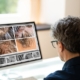 August is National Hair Loss Awareness Month, and during this time, a woman is carefully examining her hair on a computer screen.