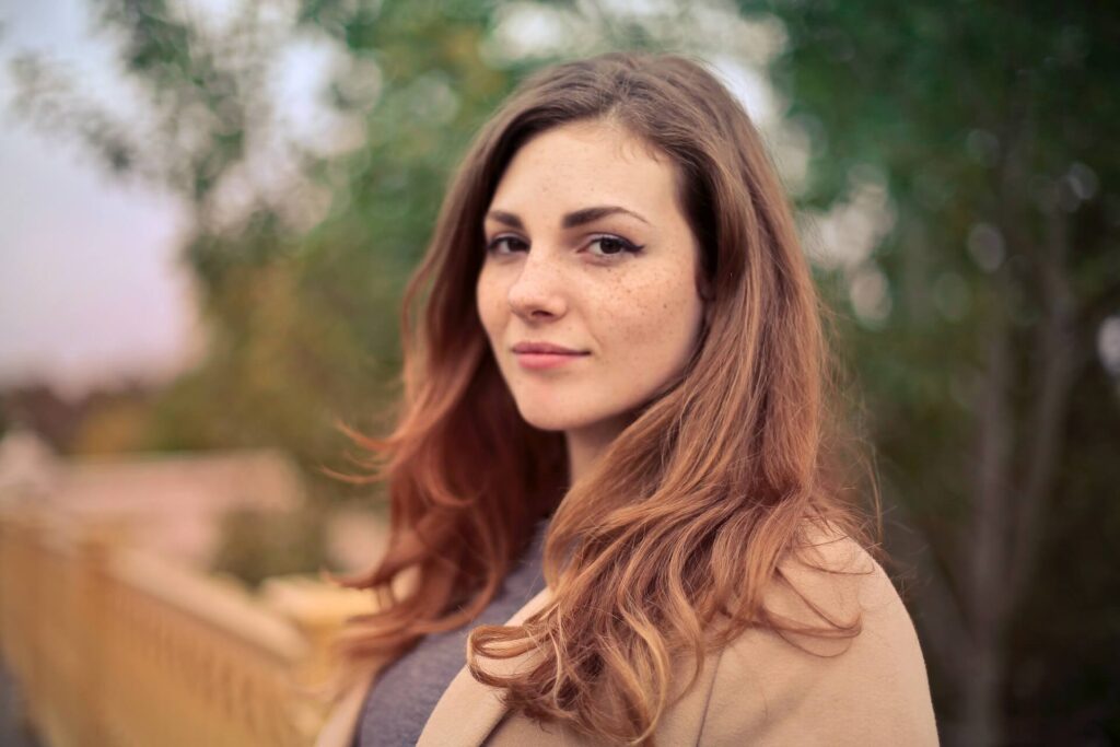 Portrait of a woman wearing a brown coat