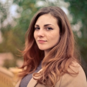 Portrait of a woman wearing a brown coat
