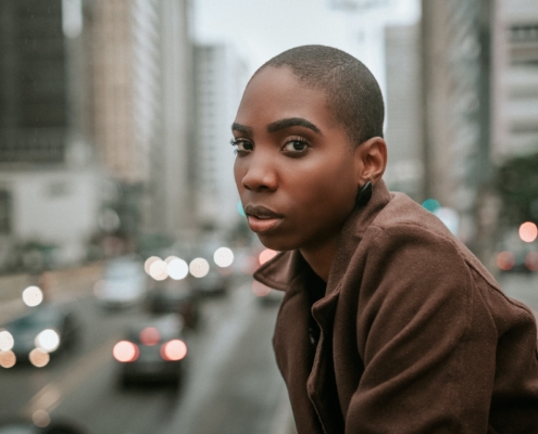 A woman looking at the camera with very short pixie-cut hair